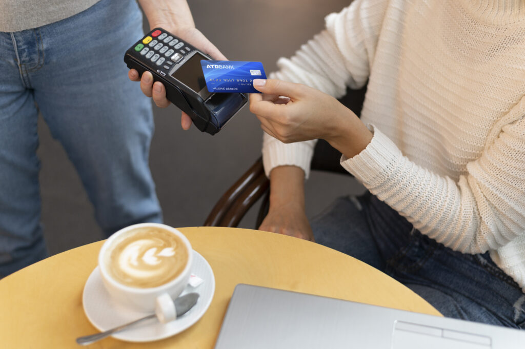 person paying with its credit card