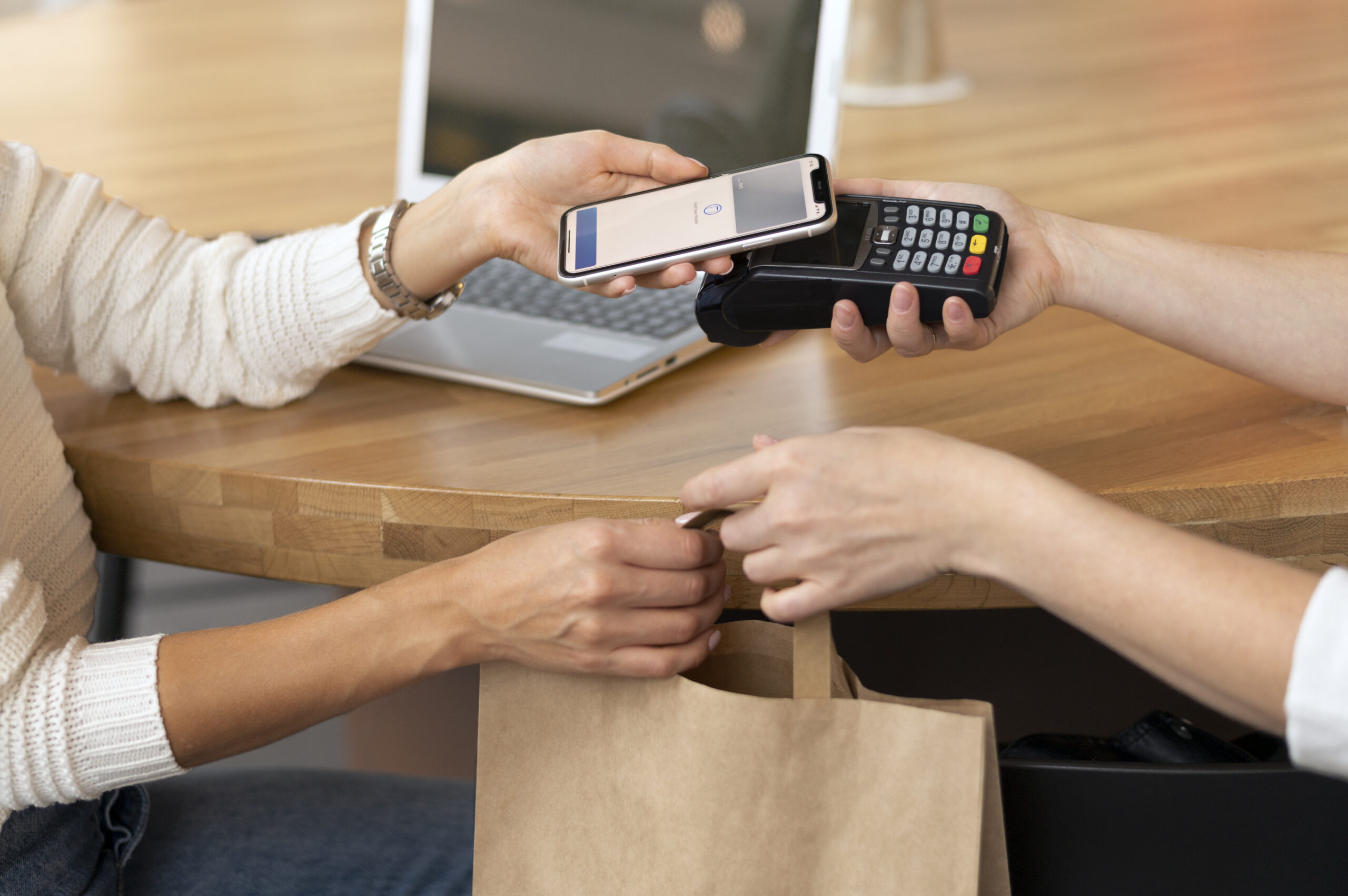 person paying with its smartphone wallet app
